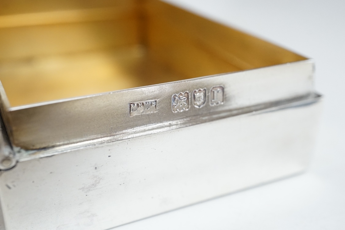 A small George V silver box and cover, possibly for snuff, by Mappin & Webb, London, 1912, 95mm, together with a later engine turned silver cigarette case, 10.6oz.